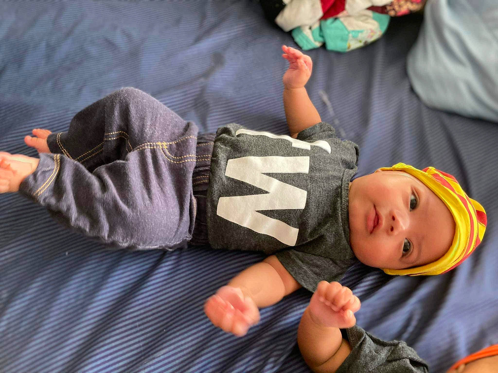 Kyson is registered to the contest to win money with this photo: arm, baby, baby_products, baby_toddler_clothing, child, comfort, elbow, finger, hand, happy, headwear, human_body, joint, knee, lap, leg, person, sitting, skin, thigh