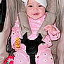 baby, child, car_seat, pink_clothing, headband, smiling, happy, floral_pattern, straps, safety_harness, infant, cute, indoors, person, young_child, seat, fabric, comfort, portrait, bright