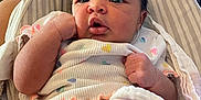 Azariah is registered to the contest to win money with this photo: baby, blanket, child, clothing, cozy, curious, cushion, expression, face, hand, head, indoor, infant, newborn, person, pink, portrait, seat, skin, soft