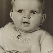Christine participe au concours pour gagner de l'argent avec cette photo : baby, portrait, black_and_white, child, ball, jewelry, necklace, earrings, soft_garment, lace, hands, face, eyes, expression, cute, infant, closeup, studio, monochrome, young_child