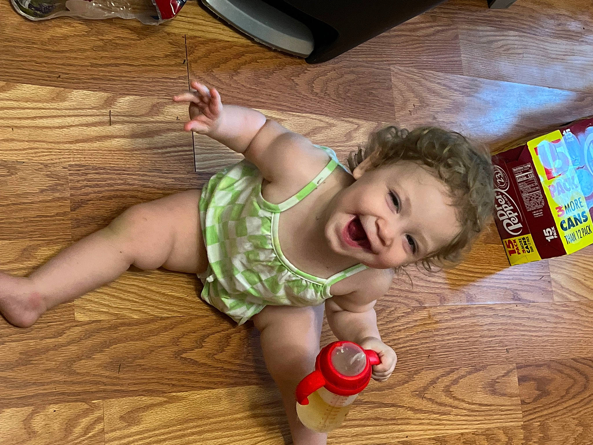 Zoey joined the competition — help win amazing prizes! baby, baby_toddler_clothing, cheek, child, eye, finger, floor, flooring, foot, fun, happy, hardwood, head, nose, person, skin, smile, thumb, toddler, varnish