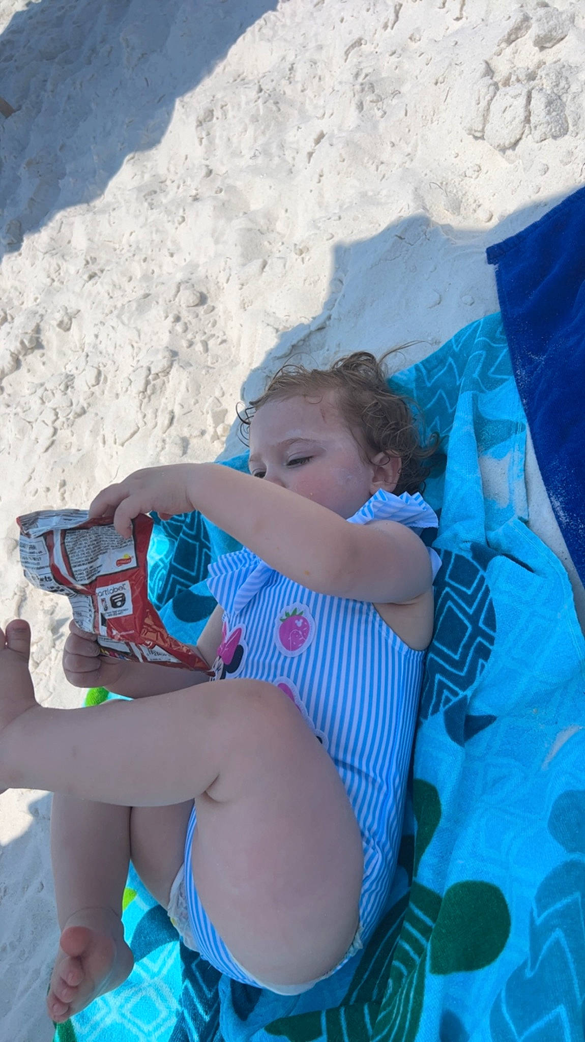 Zoey is registered to the contest to win money with this photo: azure, baby, child, electric_blue, foot, fun, grass, human_body, human_leg, knee, lap, leg, leisure, person, recreation, sitting, sun_tanning, swimwear, thigh, toddler