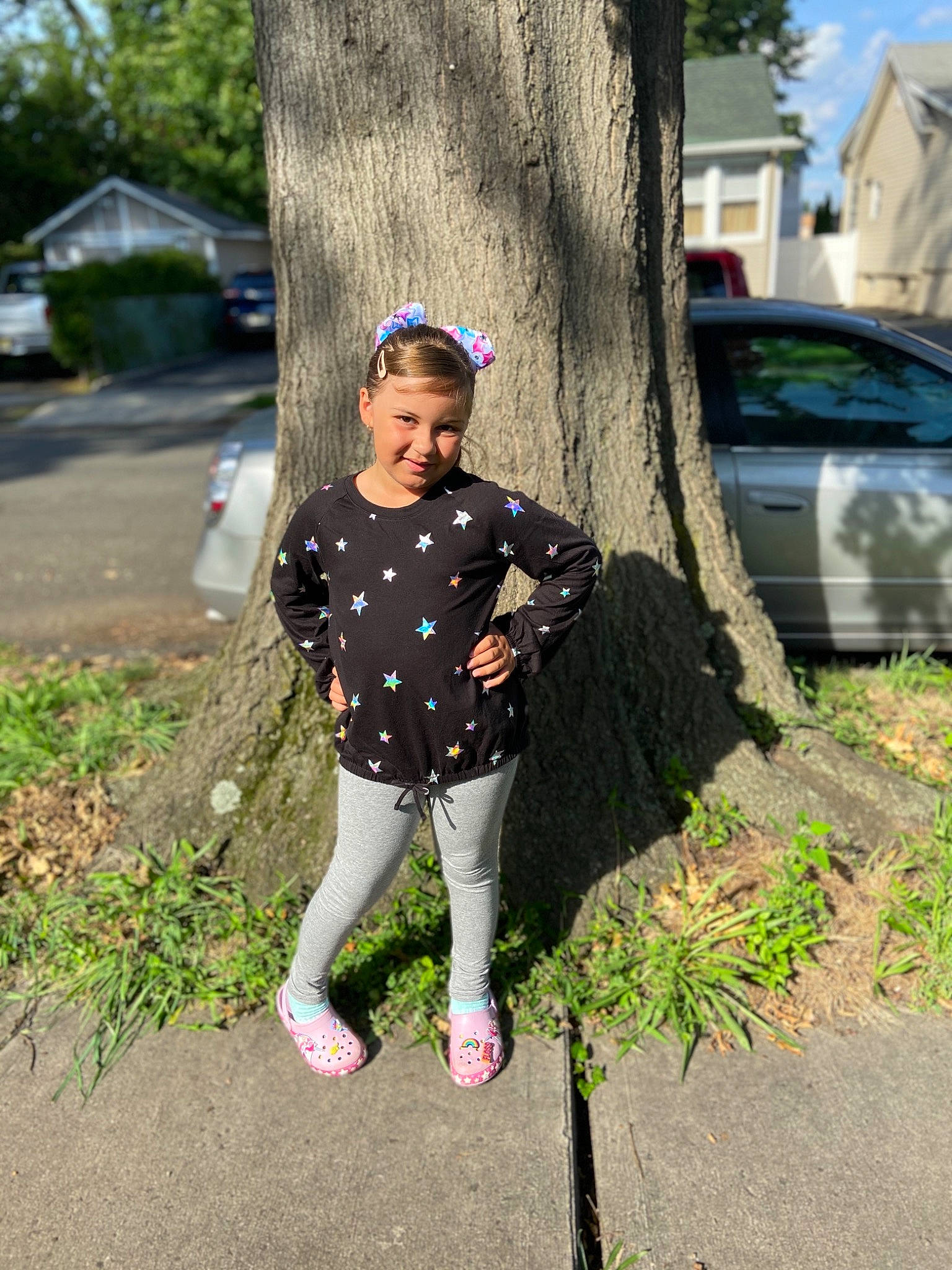 Julissa is registered to the contest to win money with this photo: asphalt, car, electric_blue, eyewear, grass, happy, joy, knee, leg, leisure, people_in_nature, person, plant, road, shoe, sidewalk, smile, street_fashion, toddler, tree