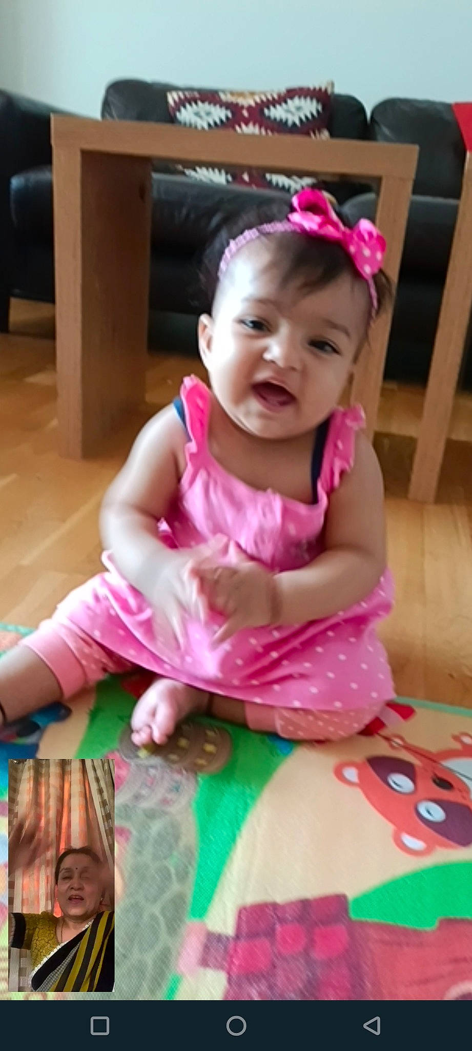 Anaya is registered to the contest to win money with this photo: baby, baby_products, baby_toddler_clothing, cheek, child, dress, eyelash, face, fashion_accessory, flooring, fun, happy, magenta, person, pink, purple, sitting, skin, sleeve, smile