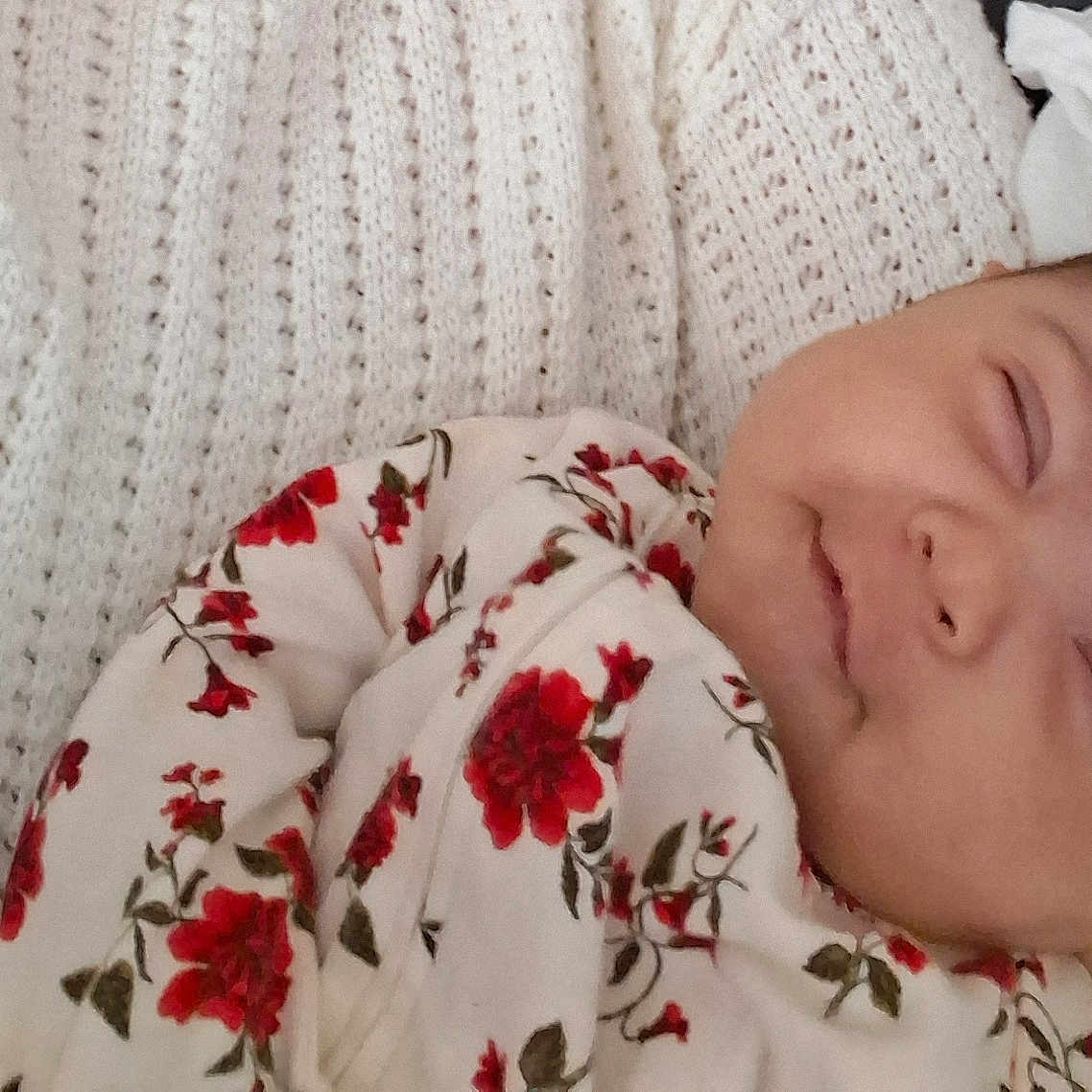 Nala joined the competition — help win amazing prizes! baby, blanket, clothing, comfort, cozy, cute, eyelids, face, floral_pattern, head, indoor, infant, peaceful, portrait, resting, skin, sleeping, smile, soft, young_child