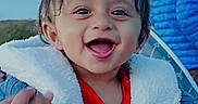 Vivaan joined the competition — help win amazing prizes! adult_hand, american_flag, baby, blue_jacket, child, clothing, coat, cute, face, hand, happy, jacket, outdoor, person, portrait, red_shirt, sky, smiling, toddler, warm