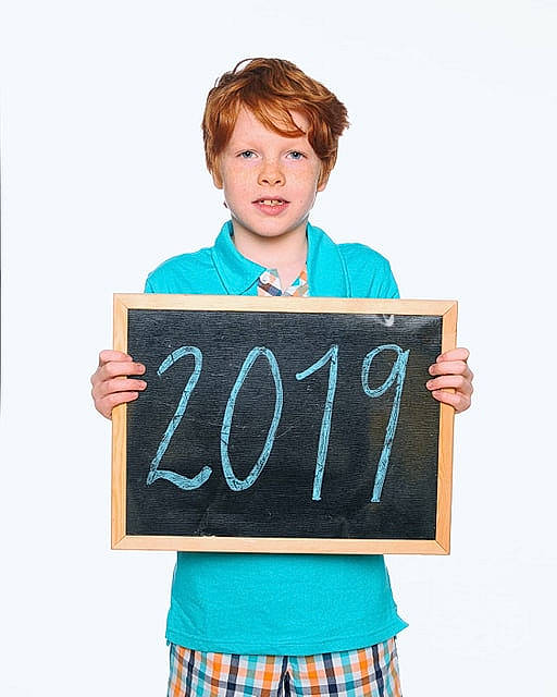Elijah is registered to the contest to win money with this photo: aqua, blackboard, chalk, child, font, male, person, smile, t_shirt, teal, toddler, turquoise