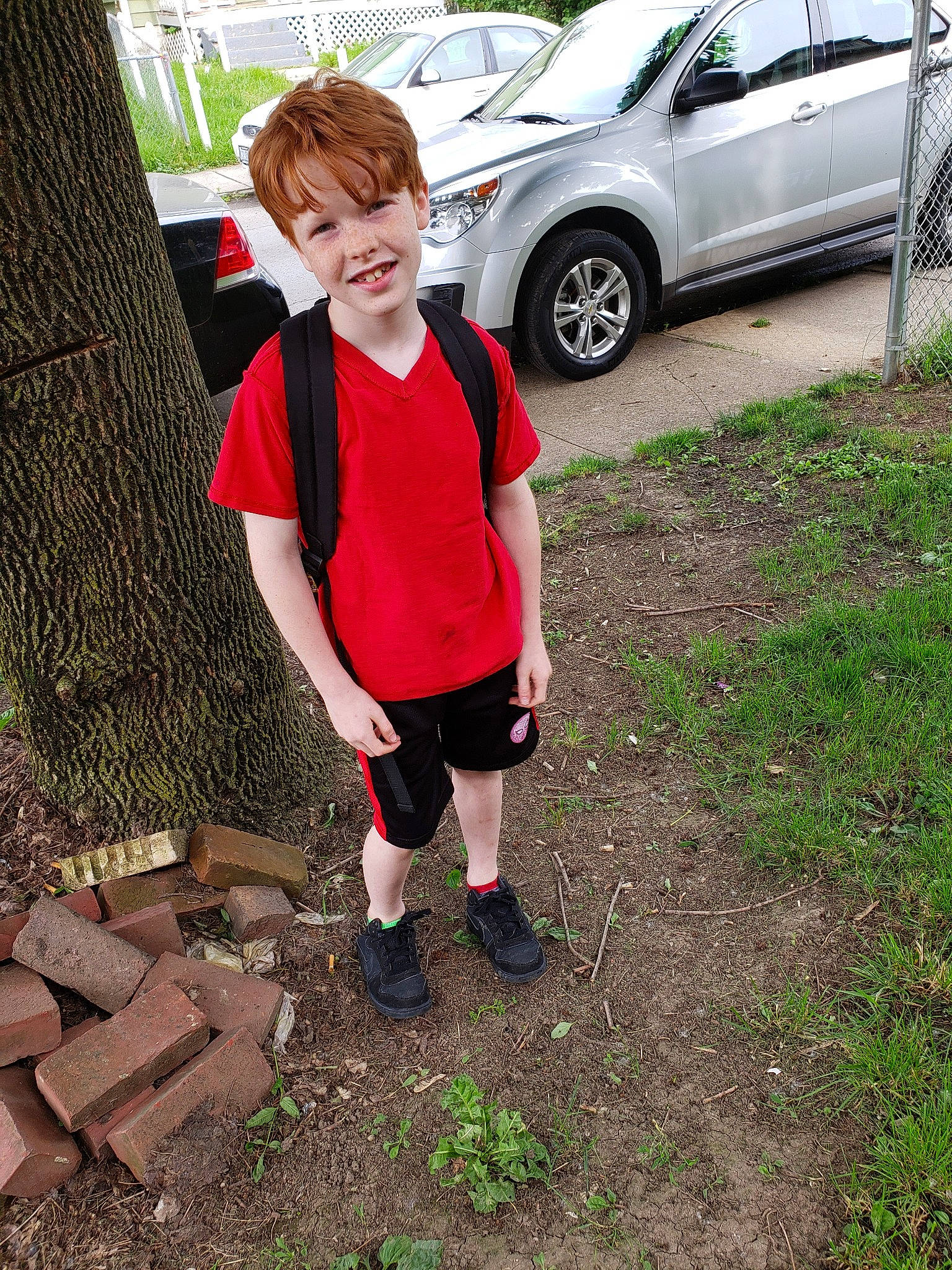 Elijah joined the competition — help win amazing prizes! car, child, compact_car, crossover_suv, family_car, footwear, grass, joy, luxury_vehicle, minivan, person, plant, red, shoe, sport_utility_vehicle, tree, vehicle, wheel