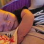 Nolan is registered to the contest to win money with this photo: baby, infant, sleeping, newborn, blanket, floral_pattern, arm, cheek, face, portrait, closeup, t-shirt, clothing, soft_light, peaceful, napping, indoors, pillow, skin, head