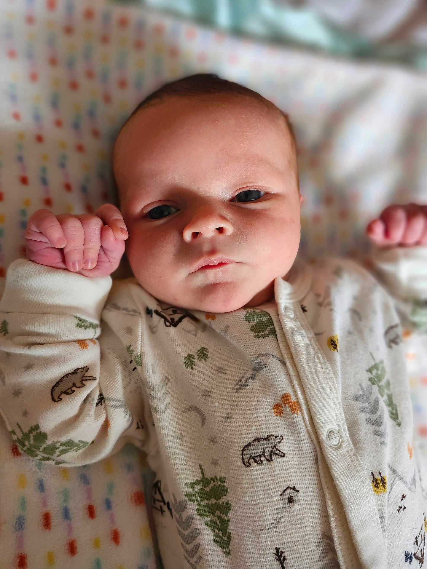 Nolan joined the competition — help win amazing prizes! baby, infant, newborn, face, eyes, hands, onesie, blanket, pattern, sleepy, portrait, closeup, skin, cute, crib, lying_down, pajamas, cozy, small_fingers, expression