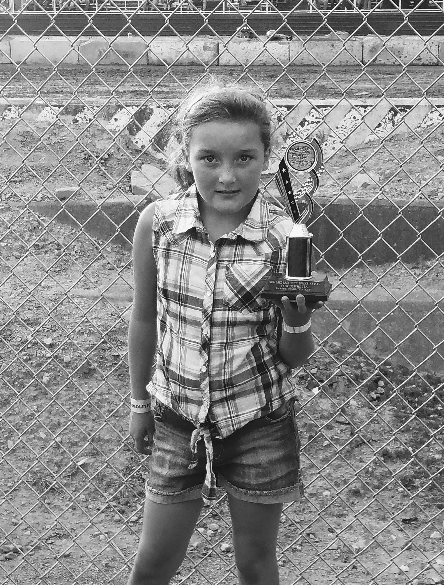 Ciley joined the competition — help win amazing prizes! black, black_and_white, chain_link_fencing, child, fence, flash_photography, grass, happy, human_leg, mesh, monochrome, monochrome_photography, pattern, person, plaid, shorts, smile, standing, style, tartan