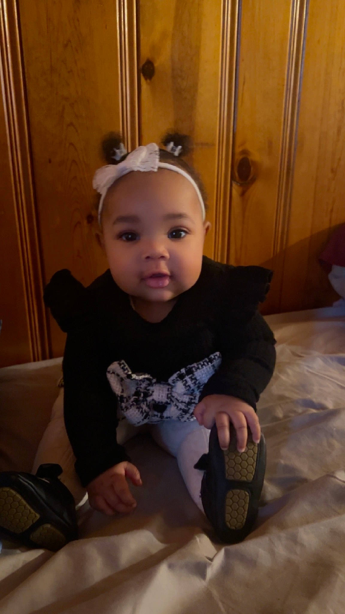 Cali joined the competition — help win amazing prizes! baby, baby_toddler_clothing, cheek, child, comfort, door, eye, finger, flooring, fun, goggles, head, human_leg, knee, person, room, sitting, sleeve, sock, toddler