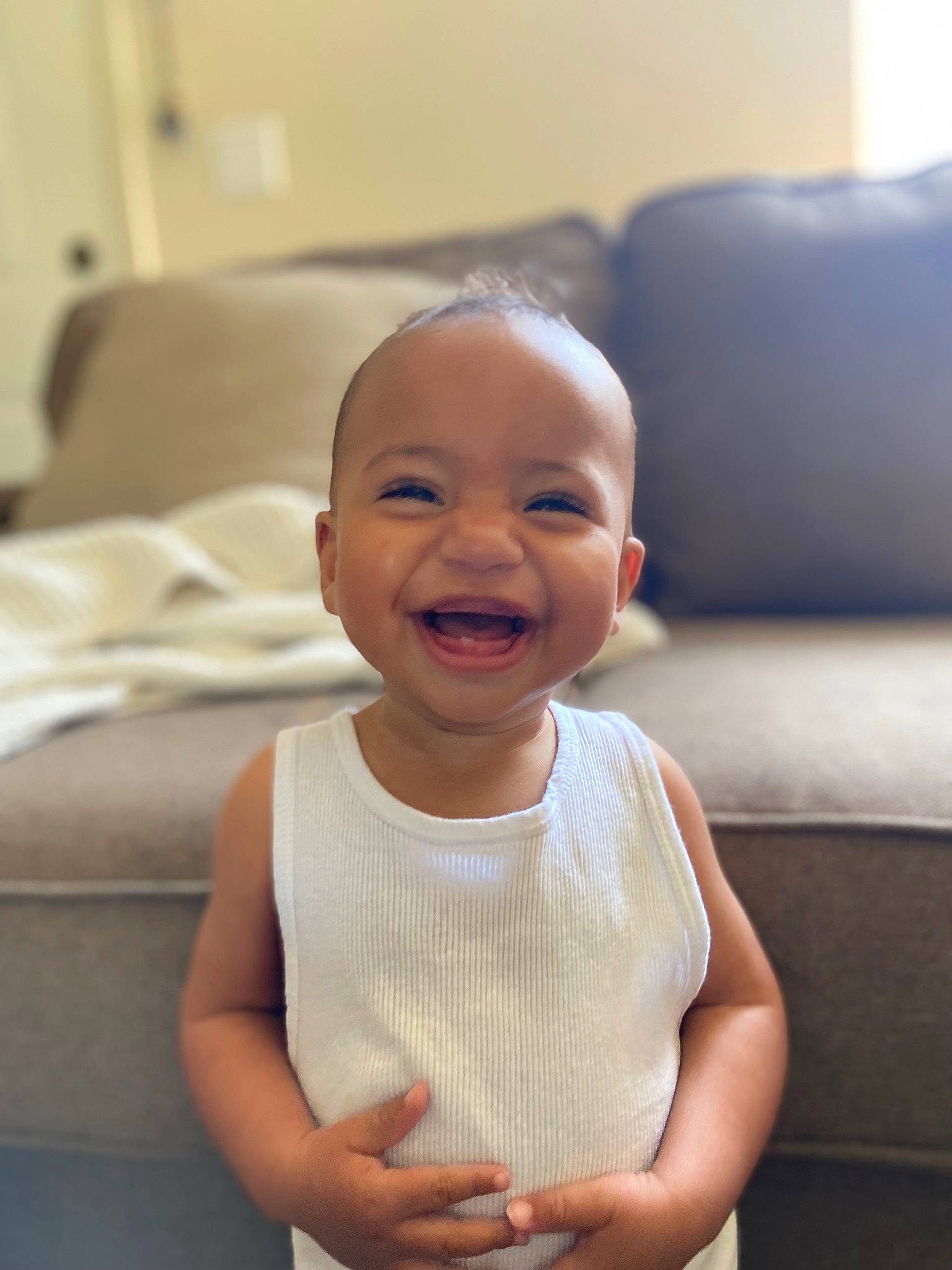 Adonis is registered to the contest to win money with this photo: active_tank, arm, baby_toddler_clothing, cheek, comfort, face, gesture, hair, hand, happy, head, human_body, iris, lip, neck, person, shoulder, skin, sleeve, smile