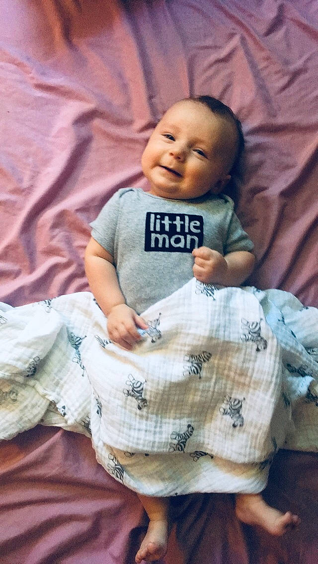 Bryer is registered to the contest to win money with this photo: baby, cheek, child, pattern, person, smile, toddler