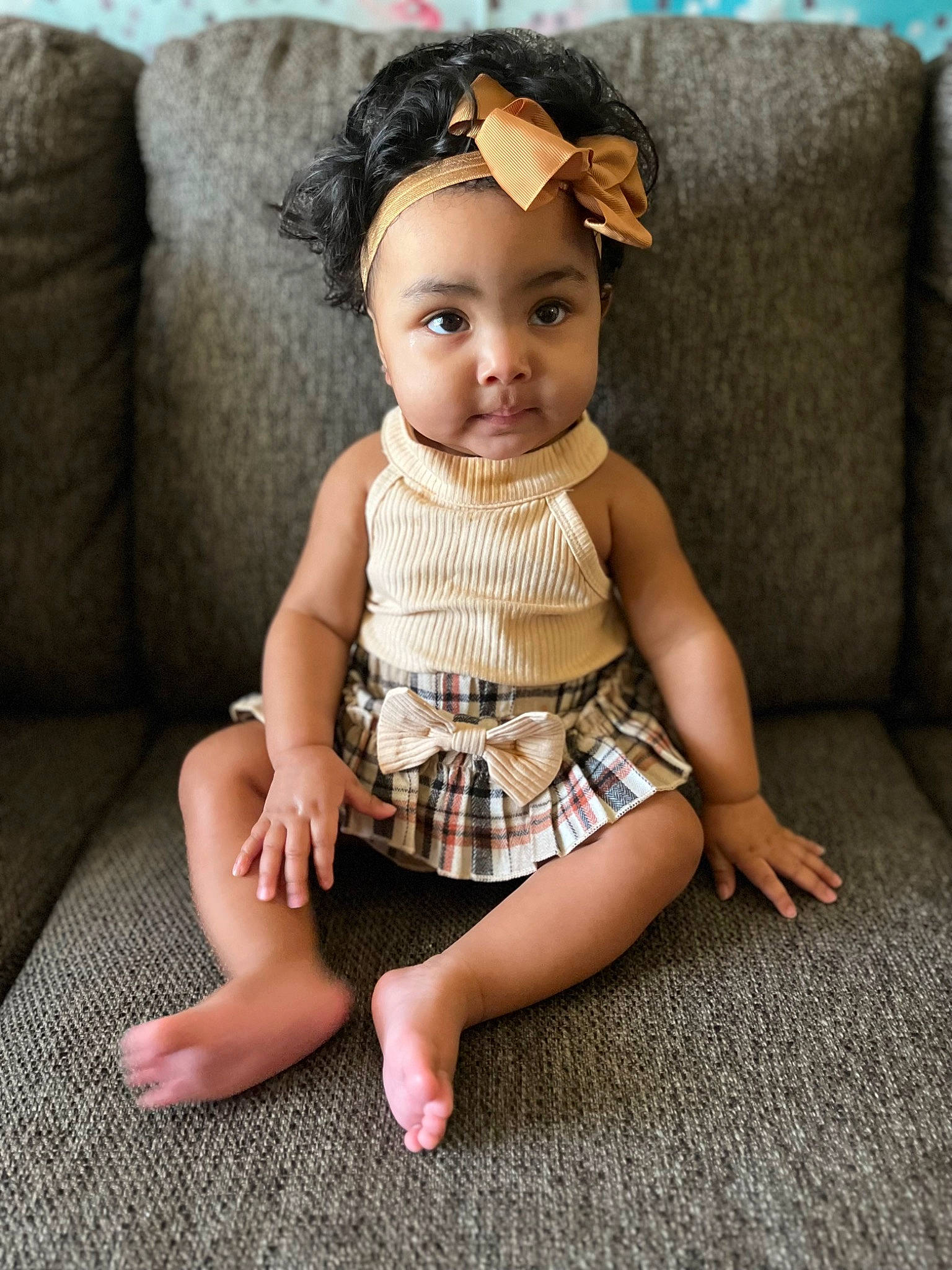 Teegan is registered to the contest to win money with this photo: arm, couch, doll, dress, eye, eyelash, finger, head, headwear, human_body, joint, leg, lip, neck, person, shoulder, skin, sleeve, textile, thigh