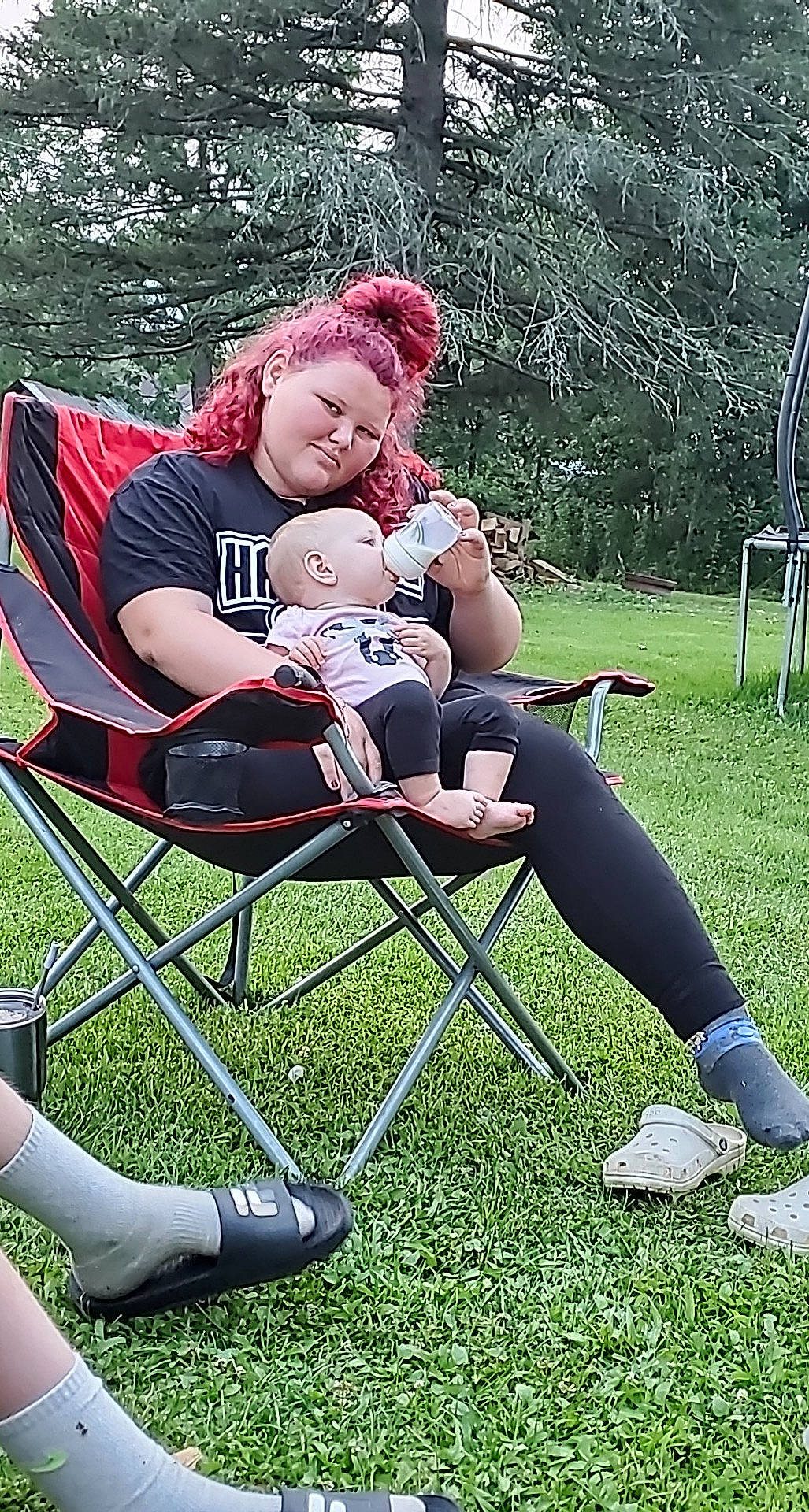 Maddilynn joined the competition — help win amazing prizes! cap, chair, comfort, folding_chair, grass, happy, joy, knee, lap, lawn, leg, leisure, people_in_nature, person, plant, recreation, shoe, shorts, smile, sneakers