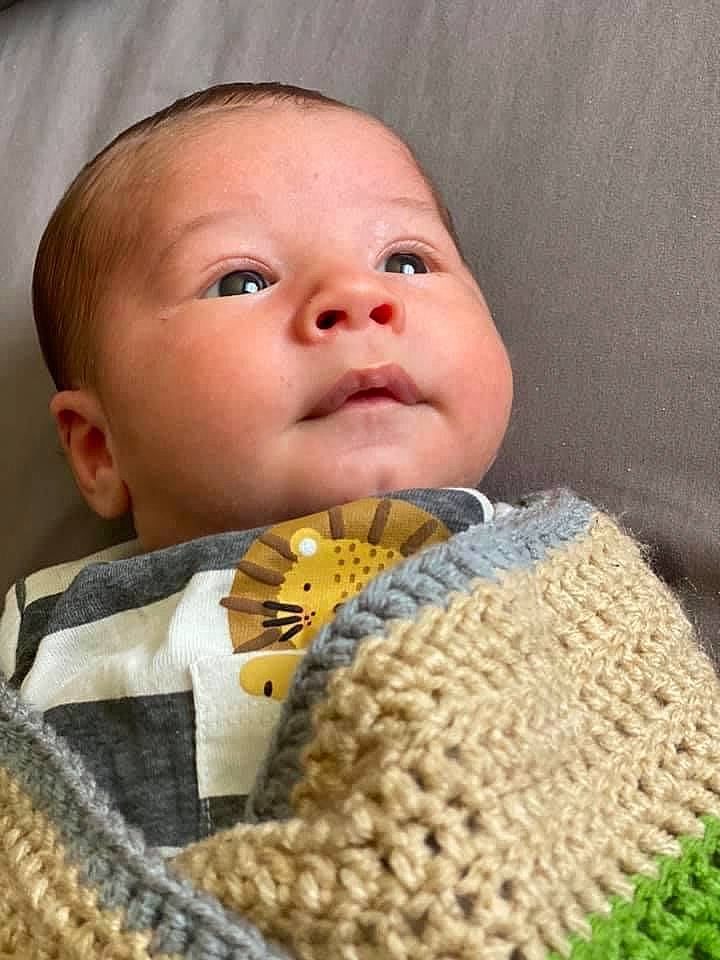 Wayland is registered to the contest to win money with this photo: baby, baby_toddler_clothing, cheek, chin, clothing, comfort, eyebrow, finger, headgear, iris, lip, neck, nose, organ, outerwear, person, product, skin, sleeve, textile