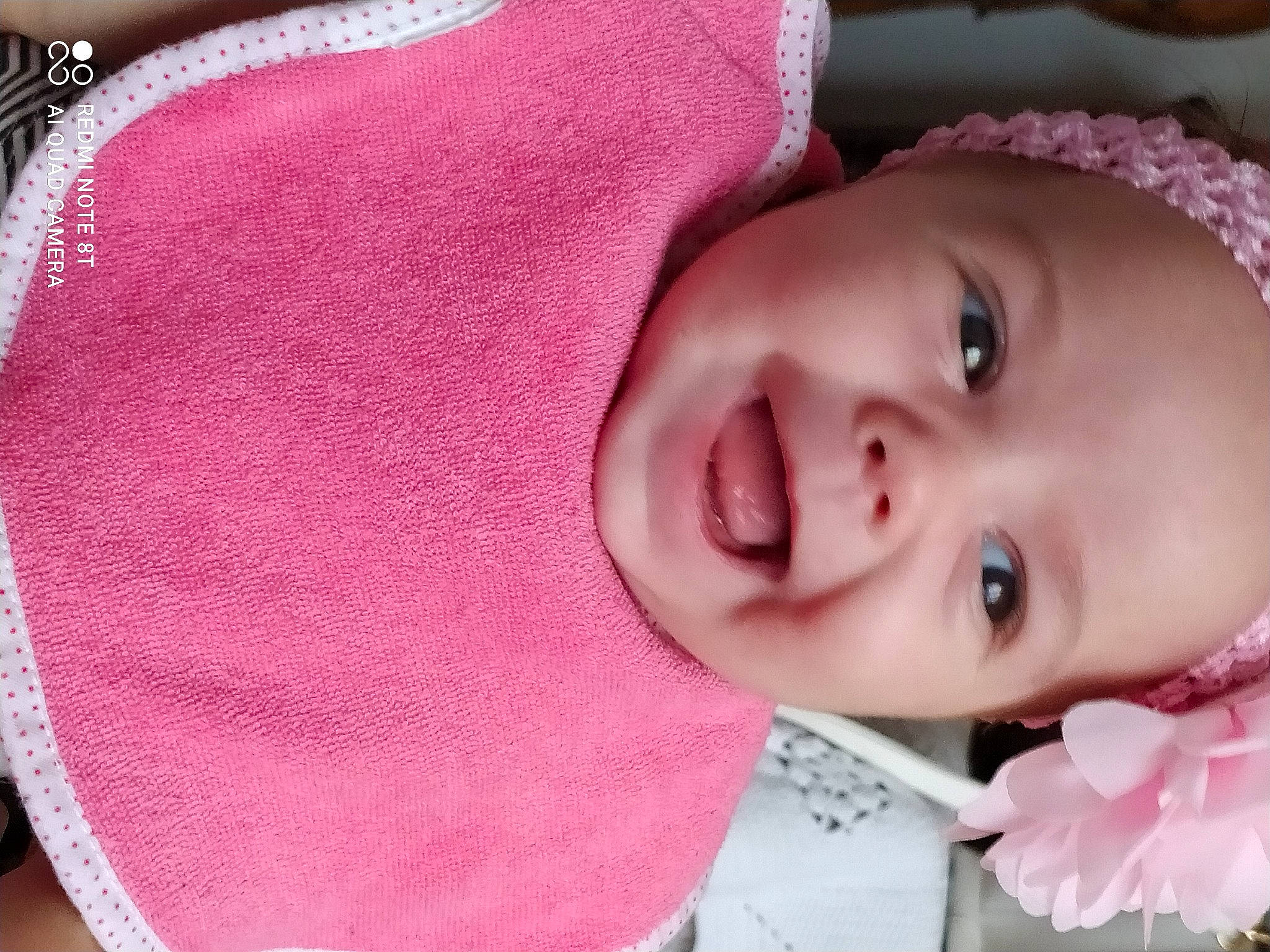 Lyah a rejoint le concours — aidez-le/la à gagner de superbes lots ! baby, baby_toddler_clothing, cheek, chin, eye, eyebrow, eyelash, face, happy, head, headwear, human_body, iris, lip, mouth, nose, person, pink, product, skin