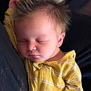Jack joined the competition — help win amazing prizes! baby, sleeping, infant, yellow_clothing, striped, hair, spiky_hair, face, closed_eyes, peaceful, cozy, cute, child, portrait, soft_lighting, newborn, relaxing, rest, person, indoors