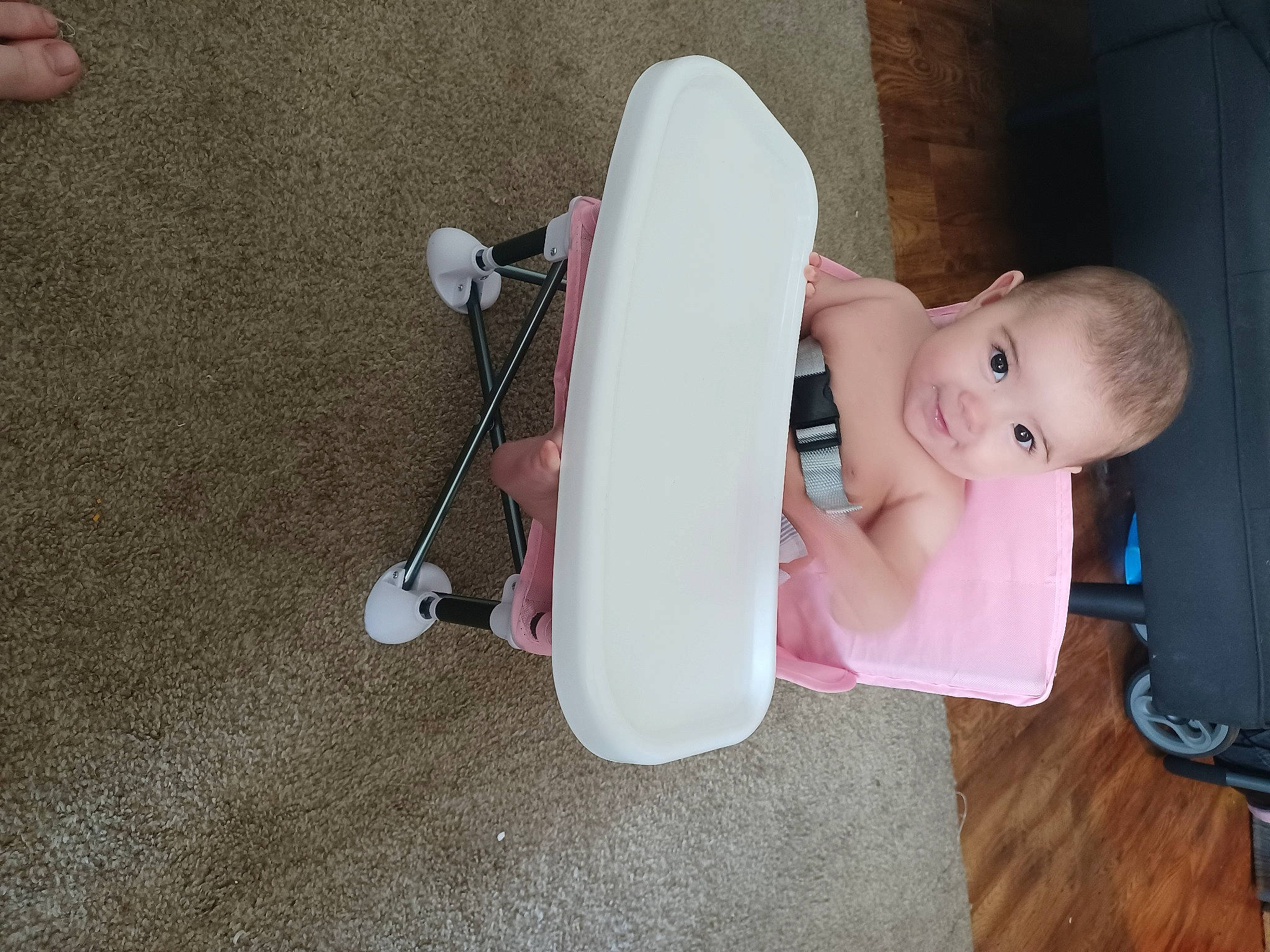 Alice is registered to the contest to win money with this photo: audio_equipment, baby, baby_products, baby_toddler_clothing, baby_toys, child, comfort, finger, flooring, fun, gadget, hardwood, joy, knee, person, room, sitting, toddler, wood