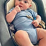 Ezio participe au concours pour gagner de l'argent avec cette photo : baby, infant, blue_onesie, baby_seat, cushion, hand, face, legs, foot, indoor, curious, child, comfort, soft, home, person, sitting, looking, cute, young