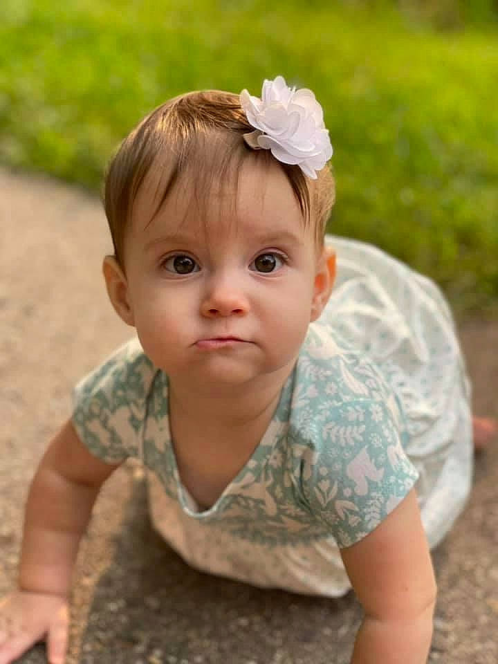 Ainsley is registered to the contest to win money with this photo: baby, baby_toddler_clothing, beauty, child, chin, eye, face, flower, grass, grass_family, happy, headpiece, iris, lip, nose, people_in_nature, person, plant, skin, sleeve