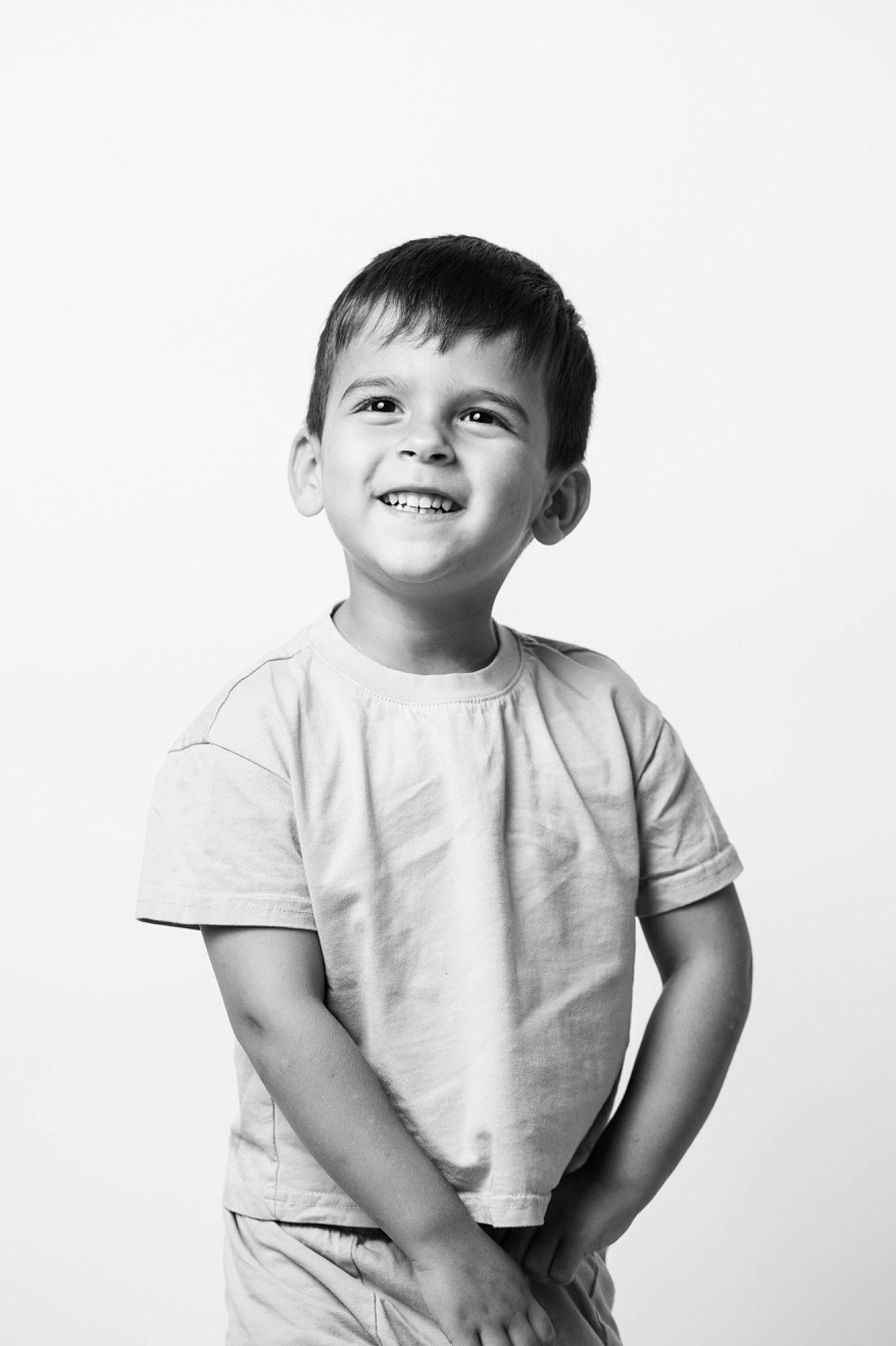 Alexander is registered to the contest to win money with this photo: child, chin, elbow, eye, face, flash_photography, fun, gesture, hair, happy, joy, laugh, monochrome, monochrome_photography, person, portrait, portrait_photography, sleeve, smile, standing
