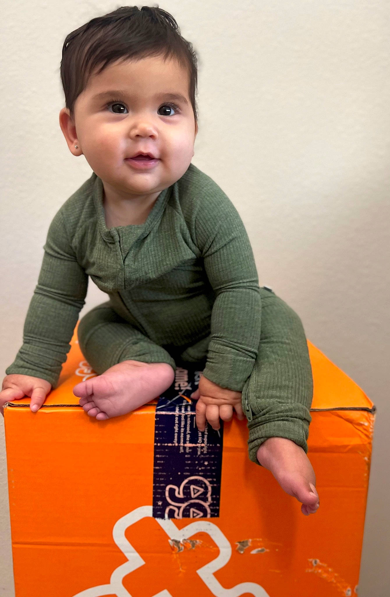 Ayda joined the competition — help win amazing prizes! baby, baby_playing_with_toys, baby_toddler_clothing, box, carton, child, drink, finger, flooring, fun, happy, musical_instrument, orange, person, play, sitting, sleeve, smile, toddler, toy