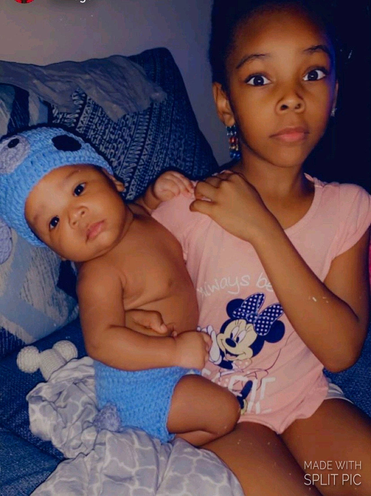 Gabrielle is registered to the contest to win money with this photo: arm, baby, blue, cheek, comfort, eye, face, facial_expression, flash_photography, hand, head, headwear, human_body, iris, mouth, muscle, nose, organ, person, skin