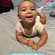 Aaliyah joined the competition — help win amazing prizes! baby, smiling, infant, bed, blanket, wipes, happy, child, indoor, cute, person, skin, clothing, arms, hands, head, face, expression, comfort, soft