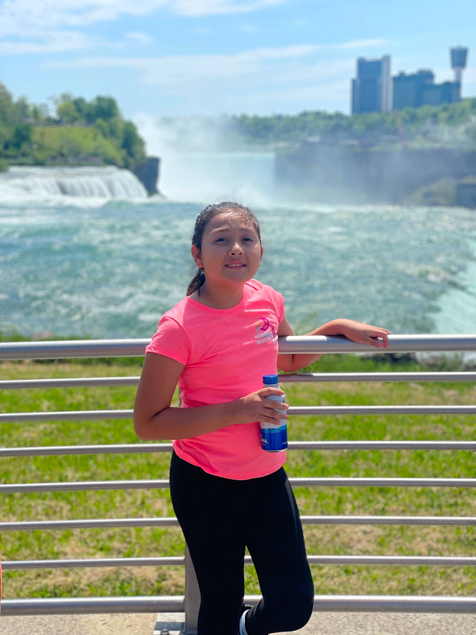 Aliyana joined the competition — help win amazing prizes! active_pants, cloud, eyewear, fence, fun, grass, happy, horizon, human_leg, joy, leisure, person, recreation, reservoir, sky, sportswear, spring, sweatpant, t_shirt, thigh