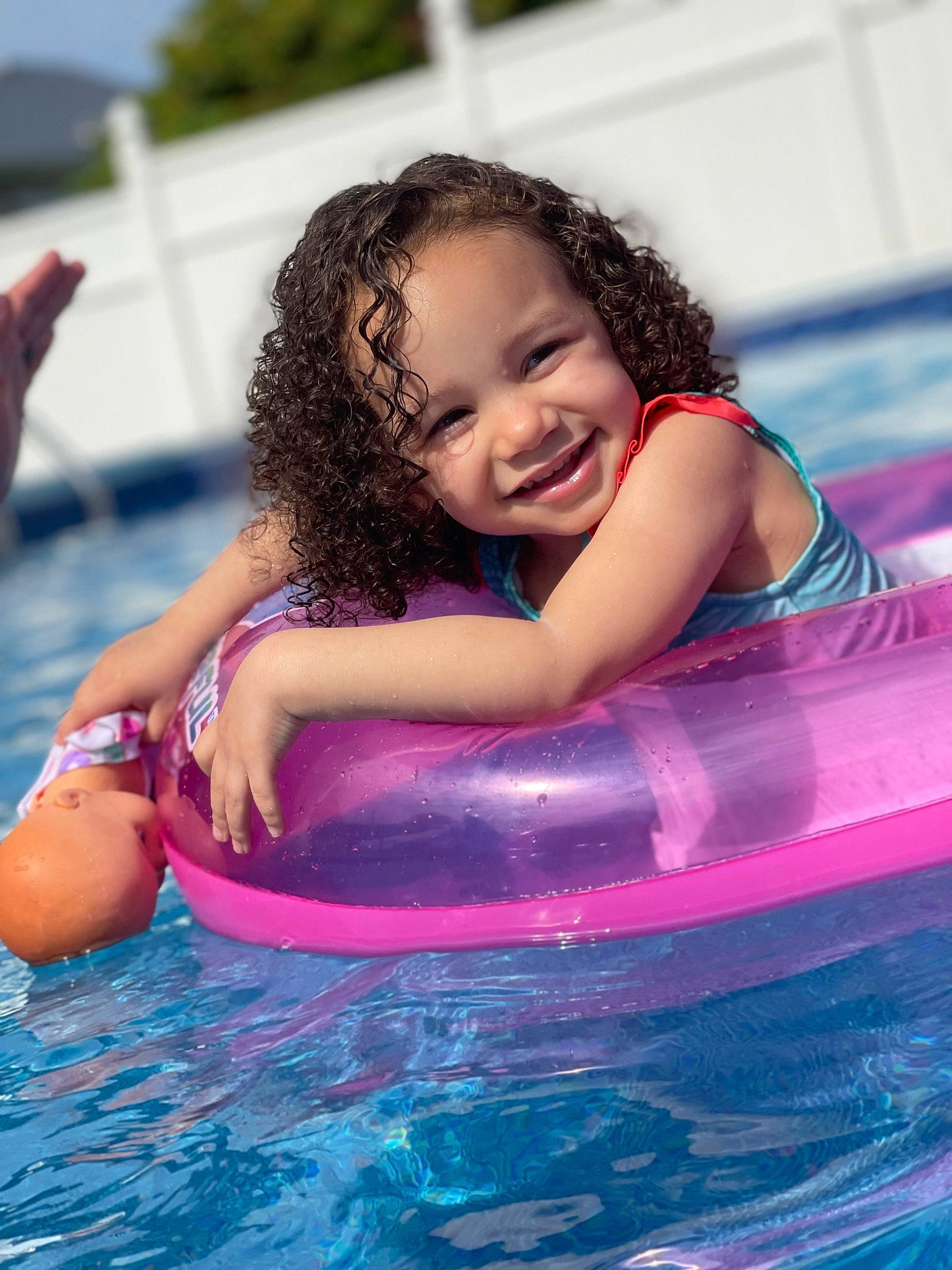 Leyani is registered to the contest to win money with this photo: baby, baby_float, bathing, boats_and_boating_equipment_and_supplies, body_of_water, child, facial_expression, fun, happy, inflatable, joy, leisure, magenta, nonbuilding_structure, outdoor_recreation, person, pink, play, recreation, smile