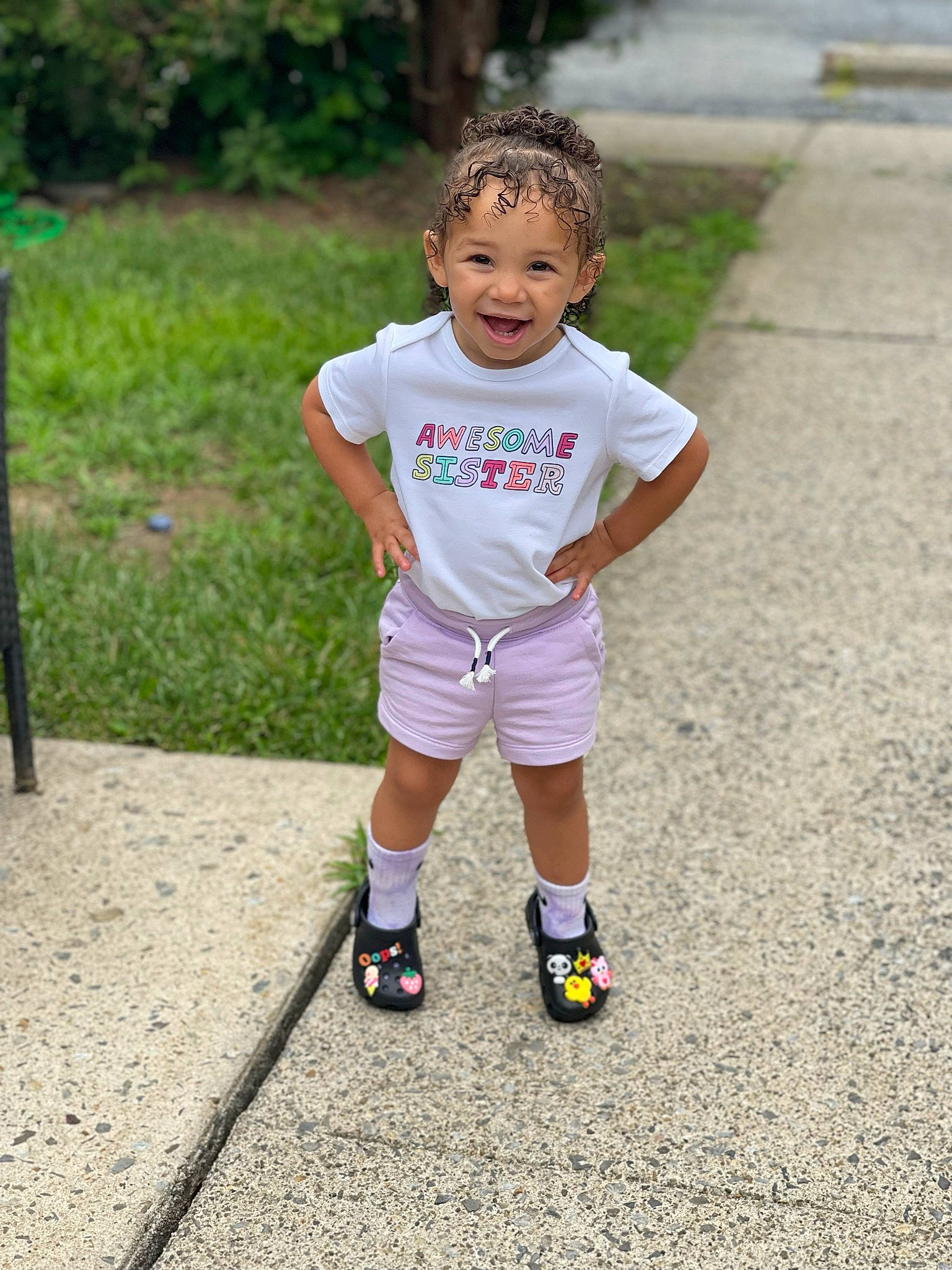 Leyani is registered to the contest to win money with this photo: arm, asphalt, baby_toddler_clothing, clothing, face, fun, grass, happy, head, human_body, joy, knee, leg, leisure, people_in_nature, person, plant, recreation, shorts, sports_equipment