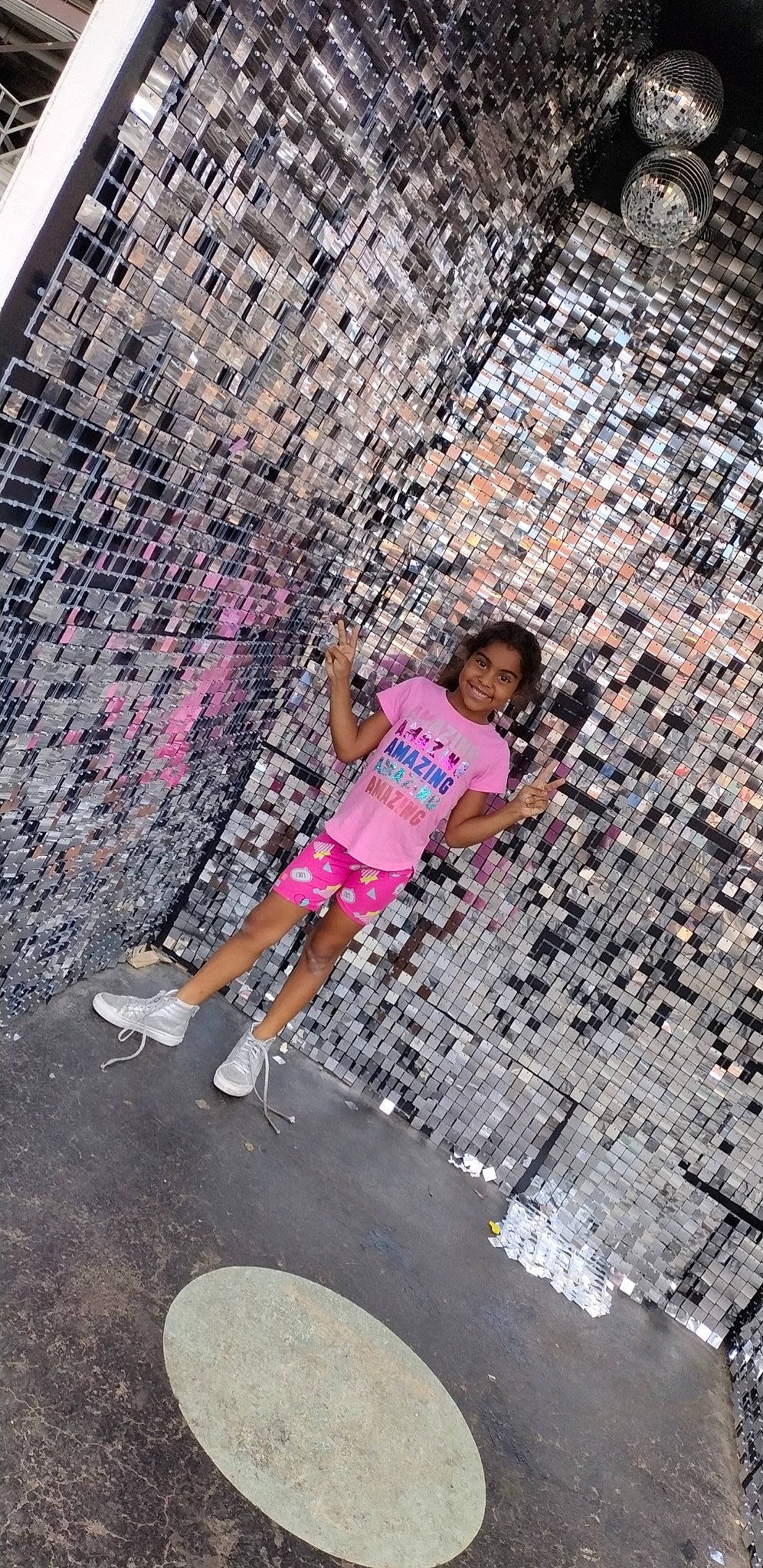 Chloe is registered to the contest to win money with this photo: asphalt, brick, city, fun, happy, human_leg, joy, leisure, line, magenta, pattern, person, pink, recreation, road, road_surface, shorts, sidewalk, street, thigh