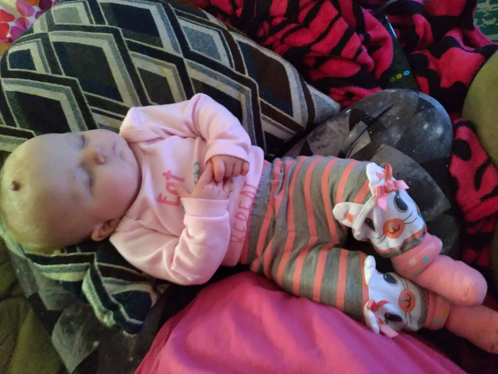 Kinzley joined the competition — help win amazing prizes! baby, baby_products, baby_toddler_clothing, cheek, child, comfort, finger, grass, lap, linens, mammal, mouth, pattern, person, pink, product, room, sitting, skin, textile