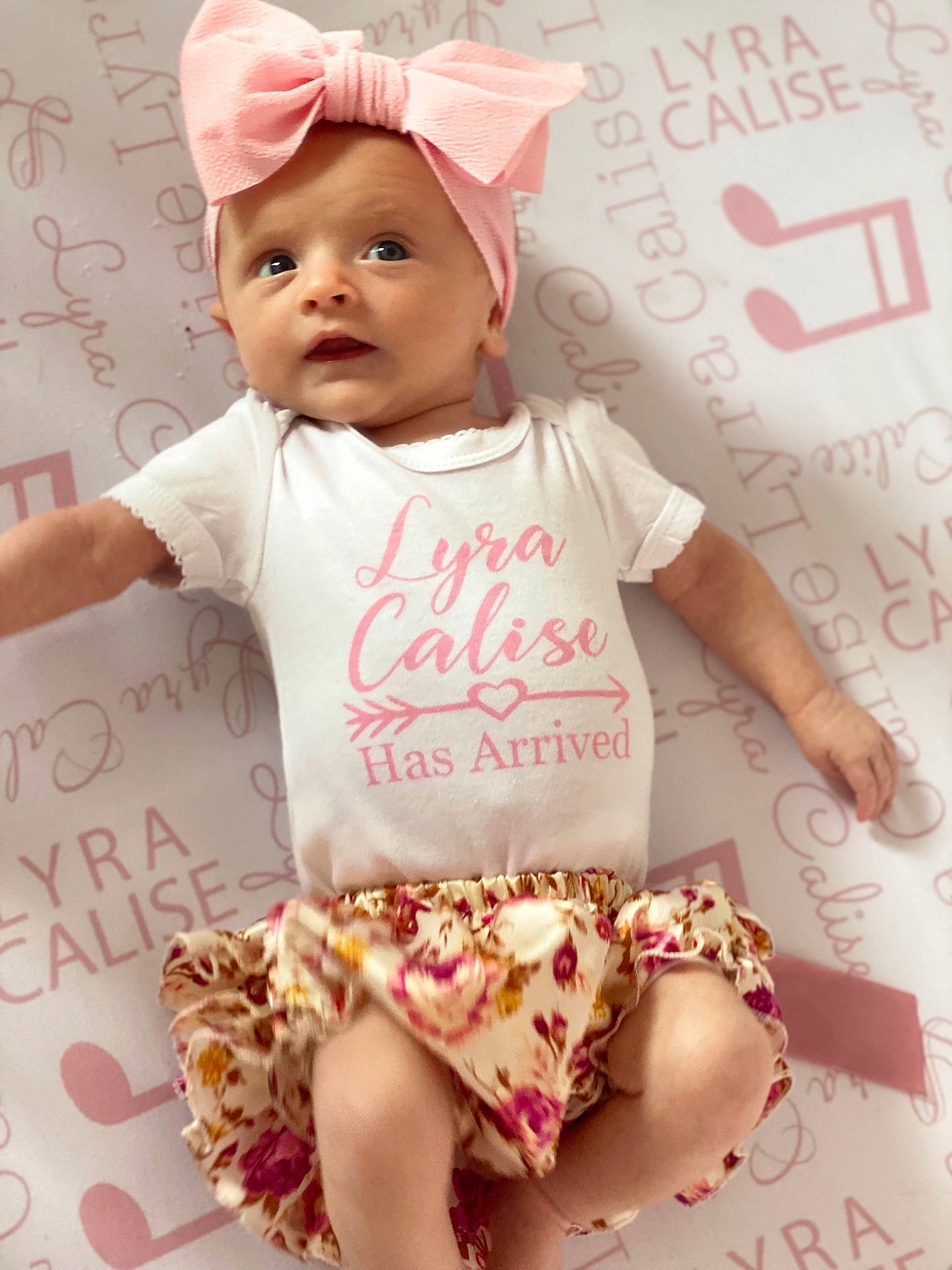 Lyra is registered to the contest to win money with this photo: baby, baby_toddler_clothing, cap, child, face, facial_expression, finger, font, happy, headgear, human, organ, people, person, pink, red, skin, sleeve, t_shirt, toddler