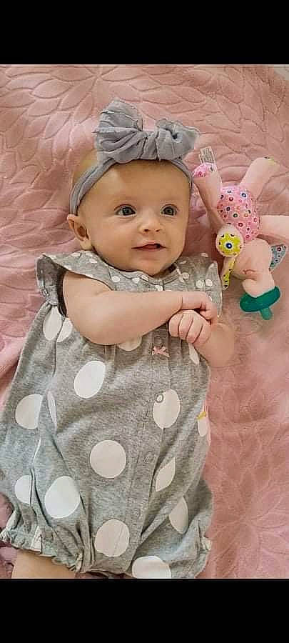 Lyra joined the competition — help win amazing prizes! baby, baby_toddler_clothing, cheek, child, dress, eye, facial_expression, grass, happy, headgear, headwear, iris, organ, person, photograph, pink, product, skin, sleeve, smile