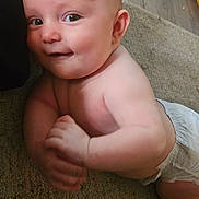 Alice is registered to the contest to win money with this photo: baby, child, infant, smiling, sitting, diaper, carpet, indoor, portrait, face, eyes, bald, happy, candid, skin, baby_pose, home, floor, close_up, adorable