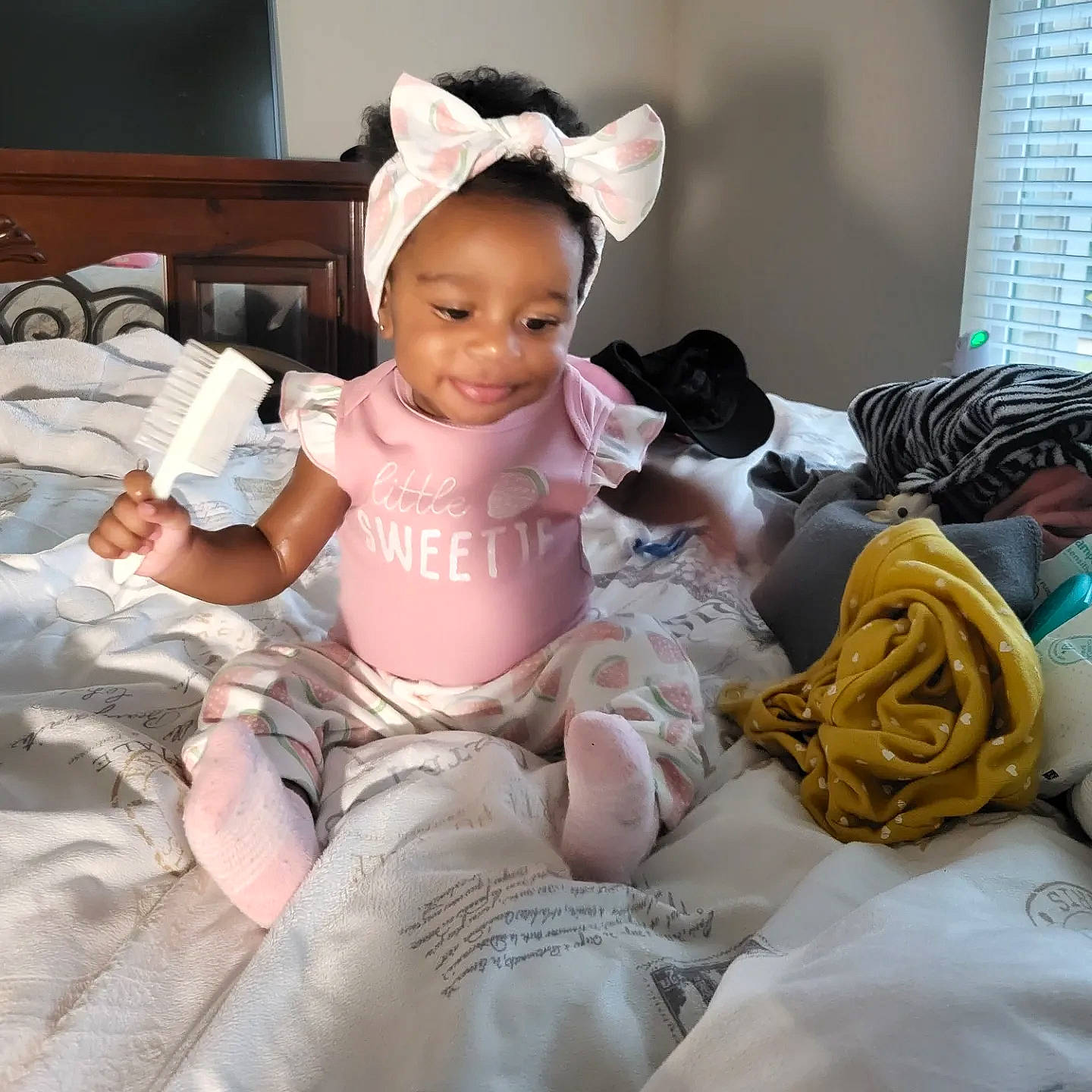 Araya joined the competition — help win amazing prizes! baby, baby_products, baby_toddler_clothing, child, comfort, costume, event, fashion_accessory, fun, happy, headband, joy, linens, pattern, person, room, sitting, smile, sock, textile