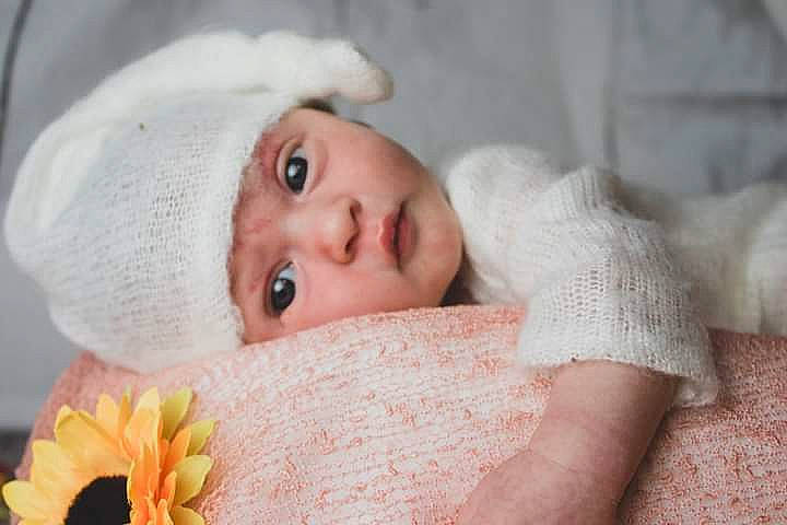 Adalyn joined the competition — help win amazing prizes! baby, beauty, cap, close_up, comfort, eye, eyebrow, eyelash, face, fur, hat, headwear, iris, linens, lip, nose, person, petal, pink, skin