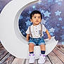 toddler, child, white_shoes, denim_shorts, suspenders, crescent_moon, starry_background, wooden_floor, indoors, portrait, cute, fashion, studio_photo, props, flooring, stars, baby, person, sitting, casual_clothing