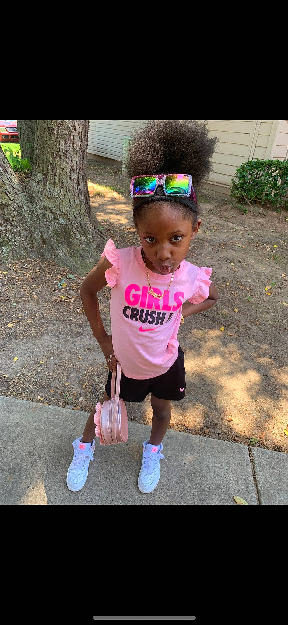 Danesha is registered to the contest to win money with this photo: baby_toddler_clothing, child, eyewear, face, fun, grass, happy, hat, leisure, magenta, person, pink, plant, recreation, shoe, shorts, sidewalk, sleeve, t_shirt, toddler