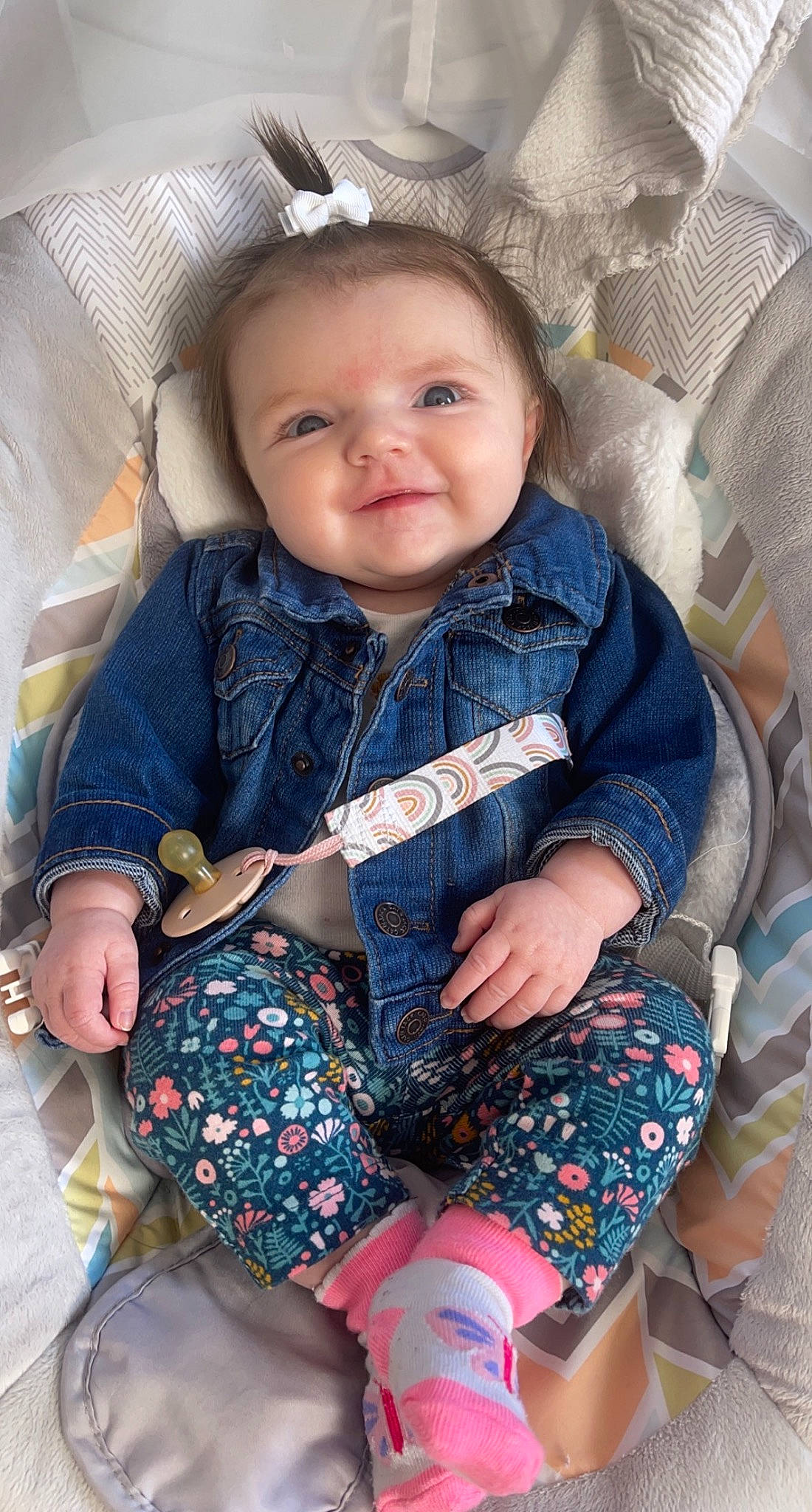 Maeve is registered to the contest to win money with this photo: baby, baby_toddler_clothing, cheek, child, comfort, eye, face, facial_expression, finger, hairstyle, happy, head, iris, outerwear, people, person, skin, sleeve, smile, textile