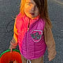 child, kid, person, outdoor, street, asphalt, bucket, candy, halloween, vest, pink, brown_clothing, shoes, sunlight, shadow, toy_bucket, fall, trick_or_treat, costume, portrait
