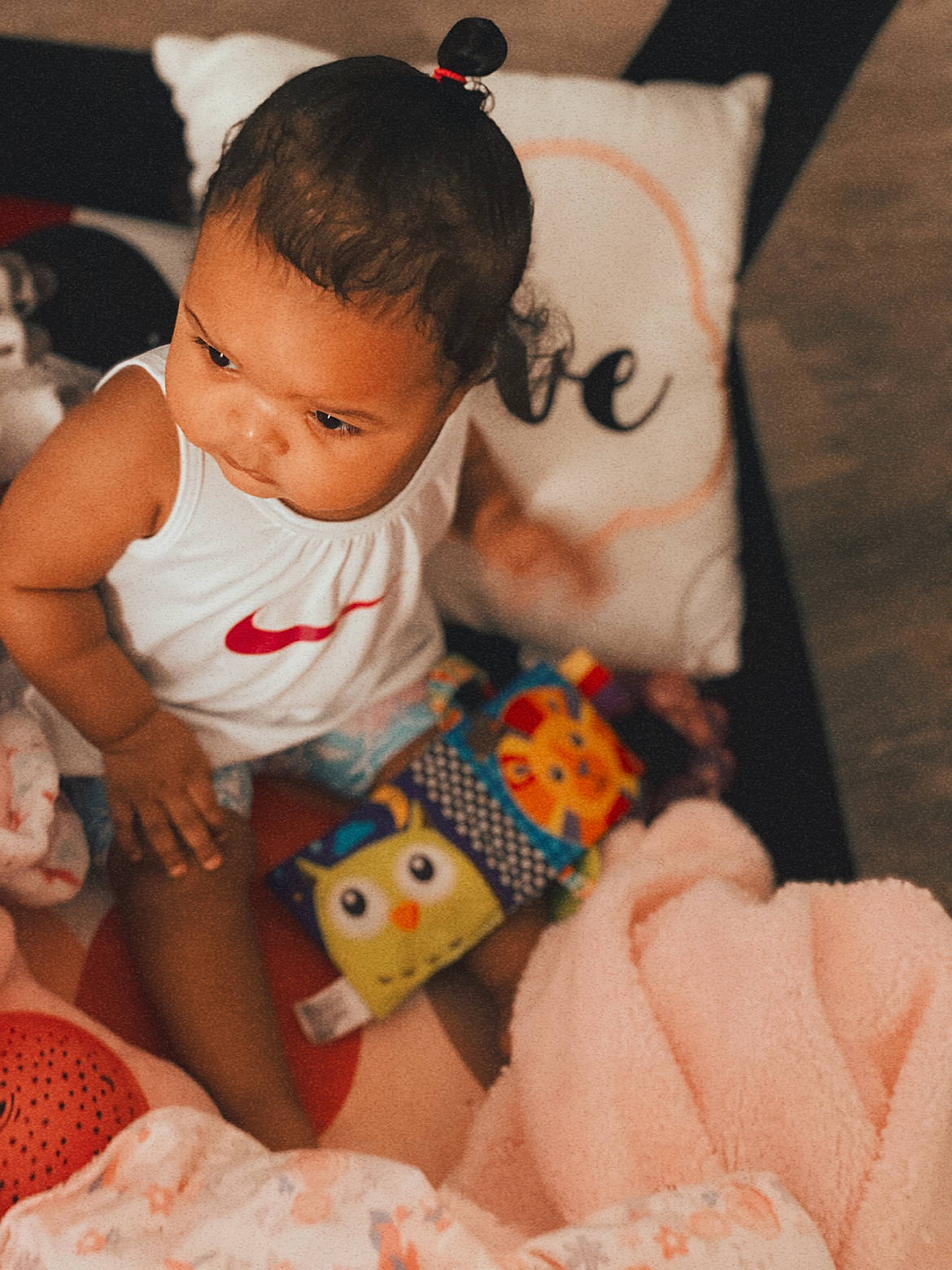 Amina is registered to the contest to win money with this photo: baby, baby_playing_with_toys, baby_products, baby_toddler_clothing, cheek, comfort, finger, happy, head, human_body, iris, mouth, nose, orange, person, sitting, skin, stuffed_toy, textile, toddler