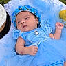 Kaitlyn is registered to the contest to win money with this photo: baby, infant, child, portrait, lying_down, blue_dress, bonnet, flower_hat, blanket, blue, baby_clothing, jewelry, pendant, earring, indoors, close_up, face, eyes_open, calm, photography