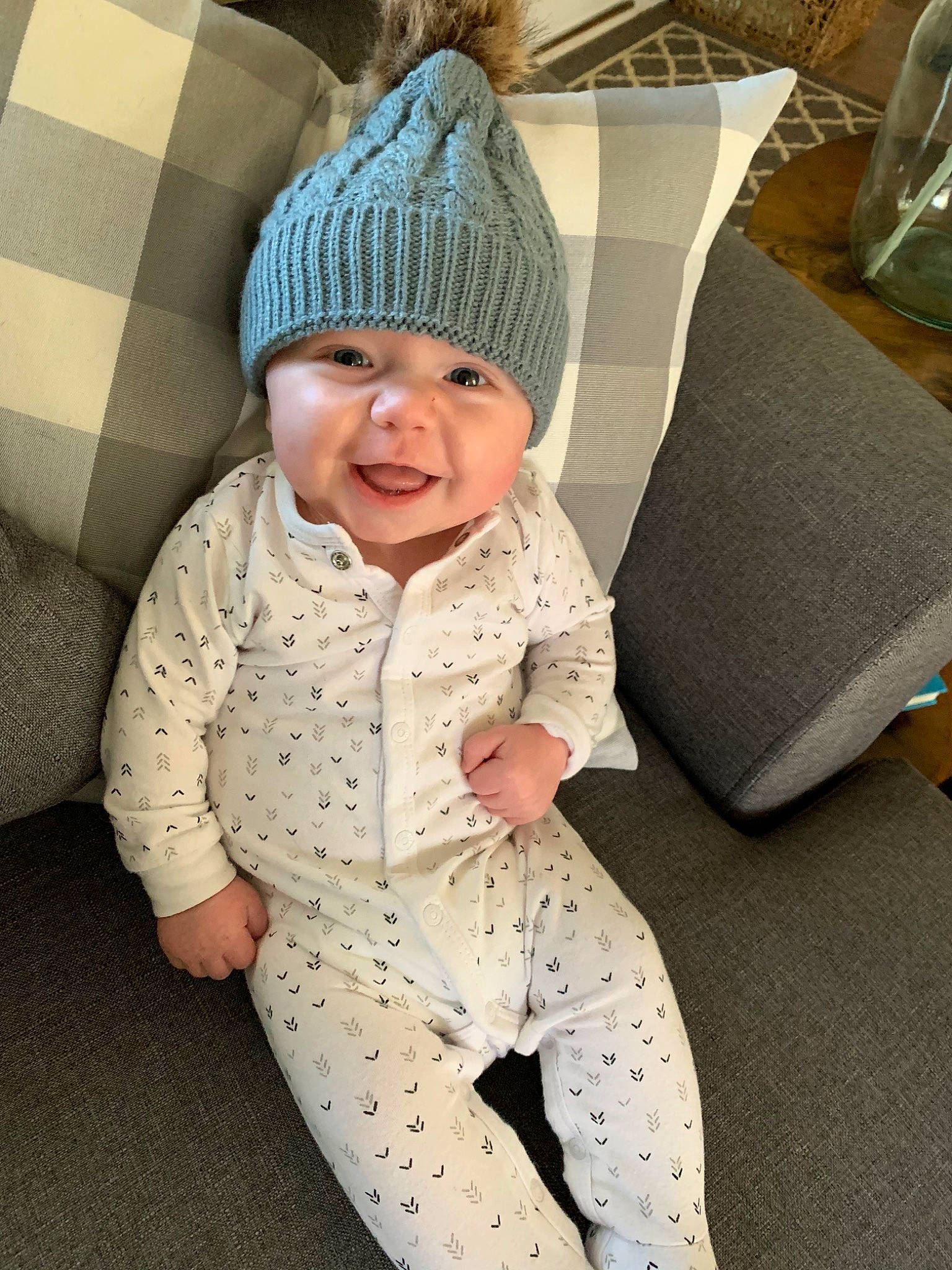 Case is registered to the contest to win money with this photo: active_pants, baby, baby_laughing, baby_toddler_clothing, beanie, bonnet, child, comfort, headband, headwear, knit_cap, knitting, laugh, nightwear, pajamas, person, sleeve, toddler, wool, woolen