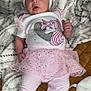 Mckenna is registered to the contest to win money with this photo: baby, infant, child, bow, headband, unicorn, shirt, tutu, leggings, pink, white, blanket, cozy, cute, clothing, feet, portrait, indoor, person, sleepwear