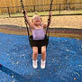 Sailor joined the competition — help win amazing prizes! child, toddler, swing, playground, glasses, purple_tank_top, sneakers, blue_play_surface, wooden_fence, outdoor, happy, smiling, summer, trees, leaves, play_equipment, joy, person, casual_clothing, daylight