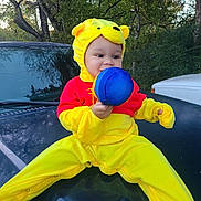 A'Mir joined the competition — help win amazing prizes! toddler, child, costume, yellow, red, plush_toy, car, hood, outdoor, trees, nature, greenery, cute, smiling, baby, playful, autumn, daylight, person, portrait